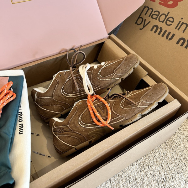 M*um*u x new balance sneaker